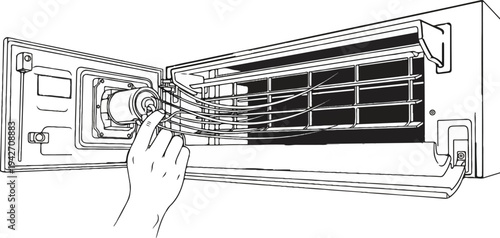 Hand adjusting louvers on an open air conditioning unit
