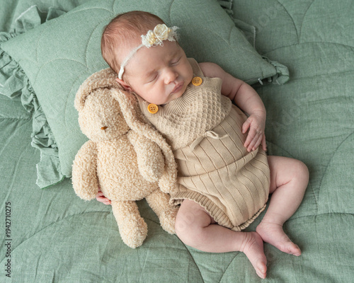 Baby care comfort shown through newborn sleeping peacefully on soft bedding