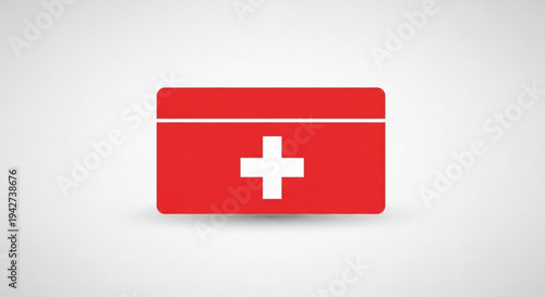 Red first aid kit box with white cross on gray background symbolizing medical emergency care and health