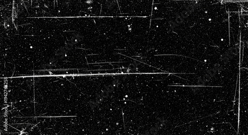 Dark cinematic background with prominent white scratches on the edges and scattered dust particles for a retro film aesthetic.