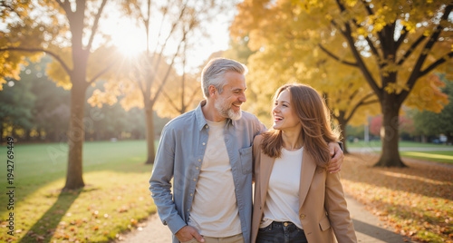 Senior Couple Embracing in Autumn Park – Golden Hour Portrait for Family Love, Retirement Lifestyle, and Relationship Content