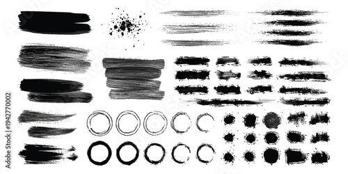 A collection of grunge ink brush strokes, splatters, and circular ring stains for graphic design