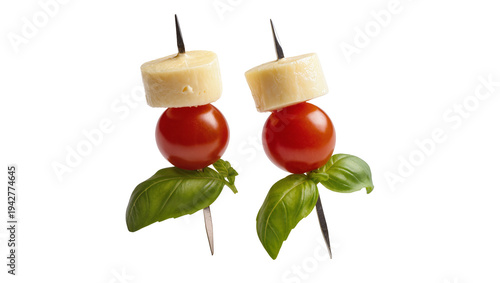 Cuadro en lienzo Isolated caprese skewers of tomato, cheese, and basil leaves on appetizer stick,