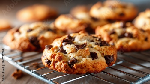 Freshly baked chocolate chip cookies cool on a wire rack, perfectly golden and inviting, ready for tasting that captures the essence of homemade goodness and warmth.