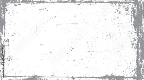 Gray distressed grunge border with speckles and scratches on white background frame texture