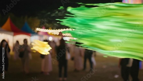 Wallpaper Mural Night festival with blurred people and colorful light trails. Torontodigital.ca