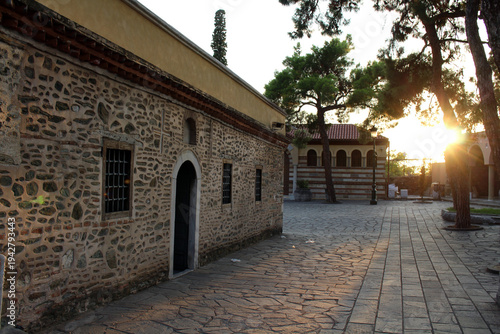 Courtyard of Vlatadon Monastery August 2024 stone church walls at sunset golden hour