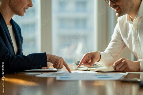 Business Professionals Discussing Financial Documents in Office Meeting