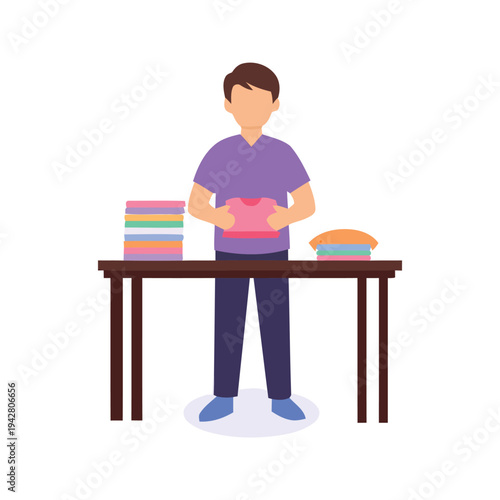 Man folding t-shirt at table with stacks of clothes in a clothing store