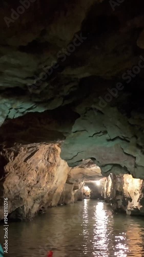 A view of the underground river in Trang An, Ninh Binh, Vietnam. Tourists visit to experience the natural wonder.