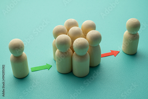Concept of personnel turnover, and turnover, in a company, expressed with wooden pawns.