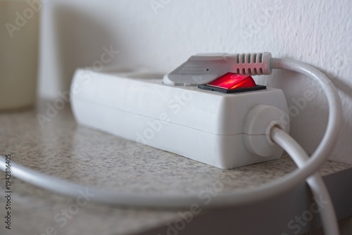 Row of turn switches on electric stove close up, fade in blur as they are further, kitchen equipment