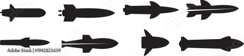 A collection of black silhouettes of ballistic missiles isolated on a white background.