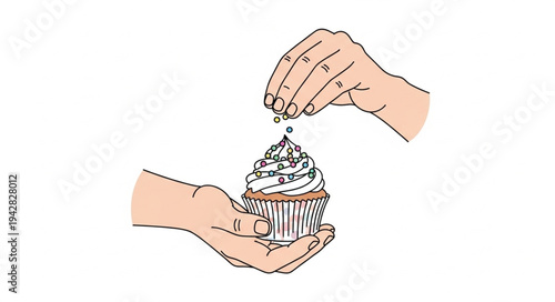 Hands Decorating a Cupcake with Sprinkles.