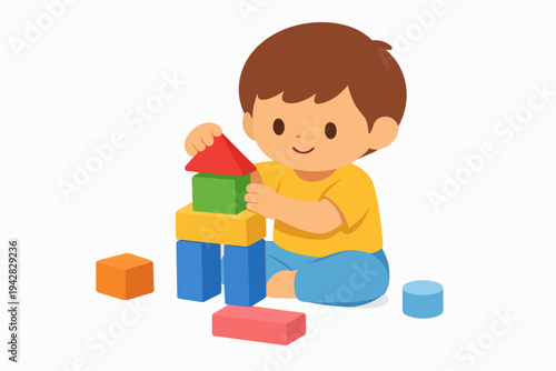 Little boy playing and building with colorful toy blocks on a white background