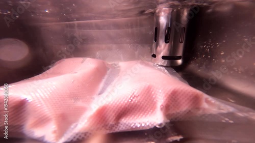 Sous vide cooking with vacuum-sealed meat