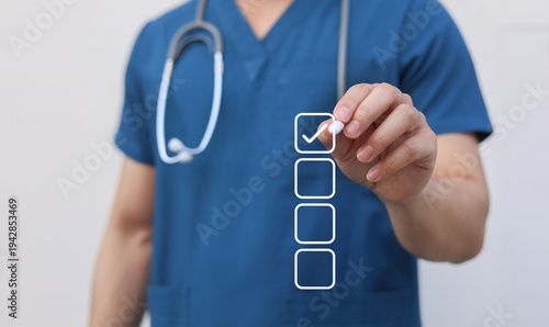 close up young general practitioner hand use stylus pen to check box on medical checklist or opd record to read and diagnose and assess about patient's symptom for healthy and lifestyle concept