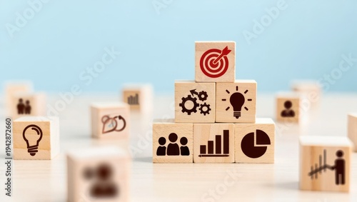 Business strategy concept with wooden blocks forming a pyramid, featuring icons for target, gears, idea, teamwork, growth, and analytics, symbolizing goal achievement and success.