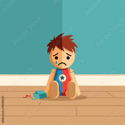 Sad child sitting on the floor with a broken toy.