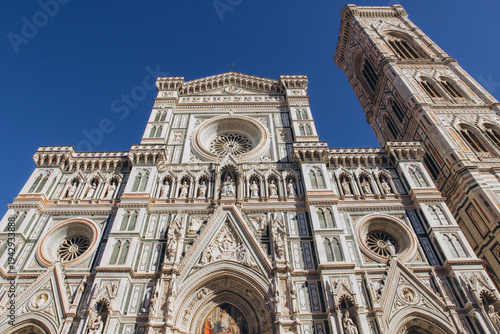 Duomo di Santa Maria del Fiore and Giotto's Bell Tower facade in Florence, Italy, admiring Renaissance architecture