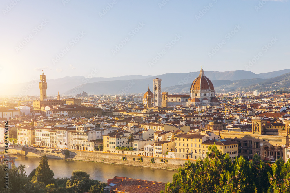 Fototapeta premium Florence cityscape with Duomo, Palazzo Vecchio, and Arno river at sunset, panorama of historic Italian architecture