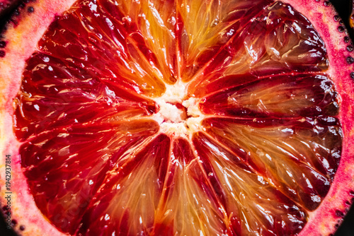 Vibrant display of a blood orange revealing juicy, sun-kissed segments and rich colors