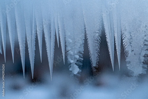 A close up of ice on a window with water droplets