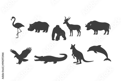 Wild animal silhouette collection including flamingo, hippopotamus, gorilla, antelope, buffalo, eagle, crocodile, kangaroo and dolphin isolated