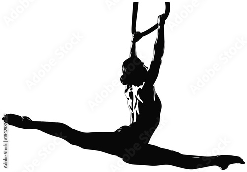 Silhouette of an aerial gymnast performing a split leap on a hoop—graceful acrobatics and a dance pose.