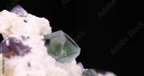 Green and purple Fluorite on Muscovite footage. From Erongo, Namibia. macro footage detail texture background. close-up mineral crystal unpolished semi-precious gemstone