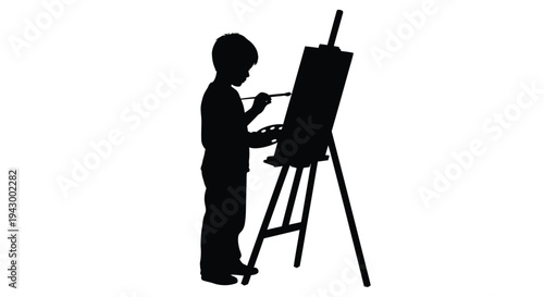 Young artist painting at an easel a striking black silhouette