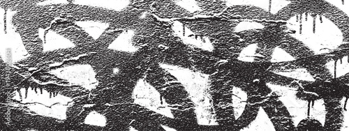 Grungy black graffiti spray paint stencil pattern with dripping effect on textured background