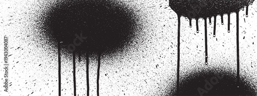 Abstract black spray paint splatters and drips on grunge textured background