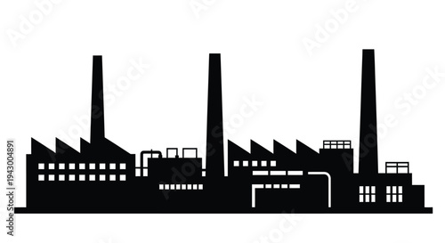 Industrial factory complex with prominent smokestacks a stark silhouette