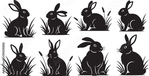 Set of black rabbit silhouettes in grassy field illustrations