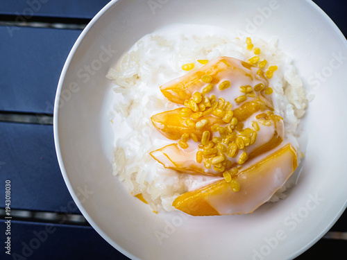 Thai mango sticky rice with coconut milk and mung beans (Khao niao mamuang)