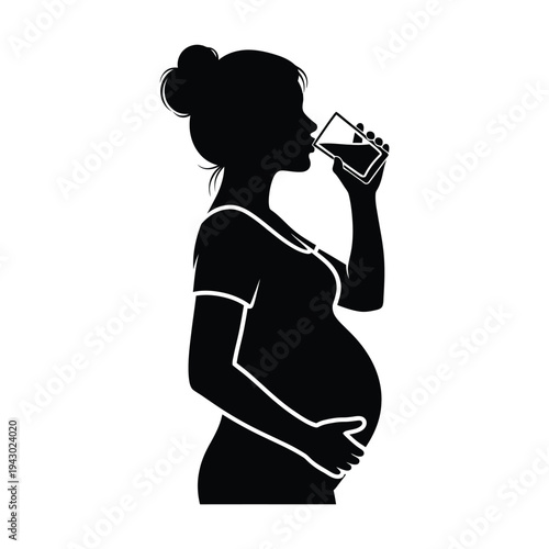 Pregnant woman drinking water silhouette.