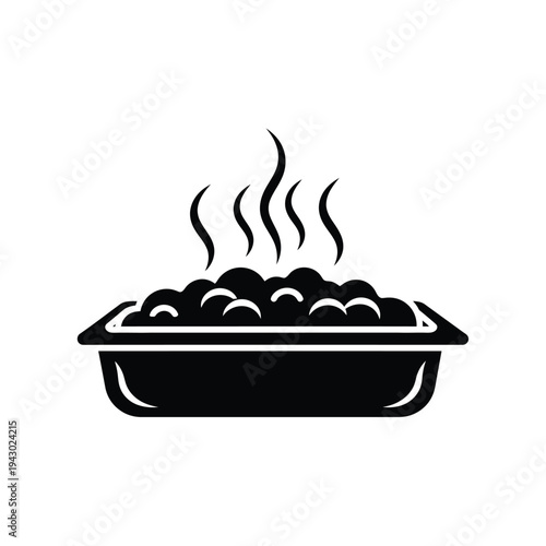 Steaming hot food in a serving dish.