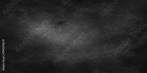 An empty vintage dark smoke background with a textured black concrete wall pattern and a rough grunge paper surface for a blank grey chalkboard backdrop design