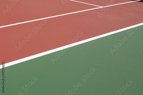 a tennis court with a red and green surface