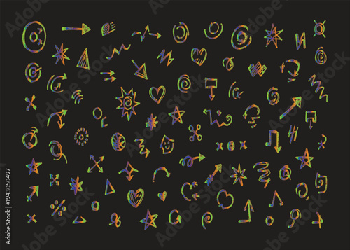A blurry image of various colorful symbols on a dark background