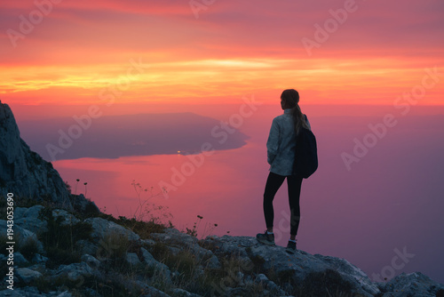 Silhouette of woman with ba...