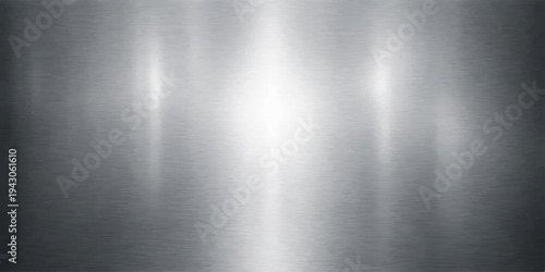 A polished silver brushed metal texture provides a shiny stainless steel plate background with a smooth metallic grey surface pattern and light reflections for a modern aluminum material backdrop