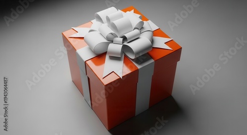 Brightly colored package wrapped with a contrasting ribbon and bow sits on a neutral surface