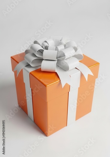 Square orange package tied with a large white decorative bow rests on a light surface.