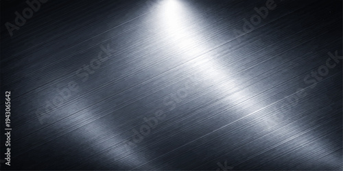 A polished stainless steel plate features a brushed metal texture with a shiny silver surface and industrial grey pattern reflecting light across the smooth metallic aluminum sheet