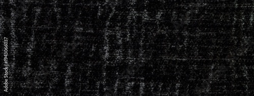 Black fluffy velvet fabric texture background, soft shiny velour textile macro. Dark backdrop