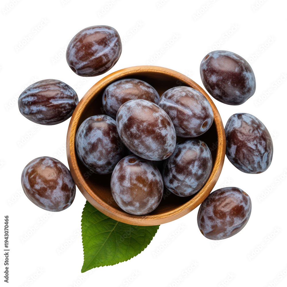 Obraz premium A small wooden bowl filled with speckled brown plum like fruits and a single green leaf on transparent background