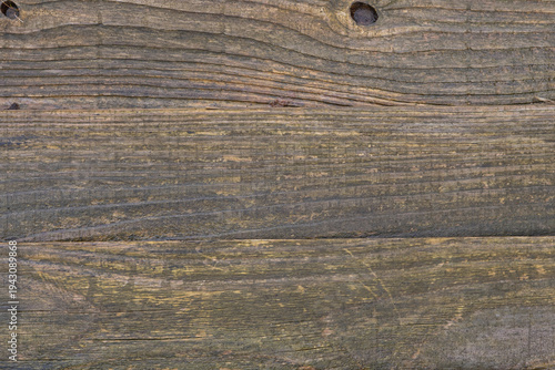 Weathered wooden plank texture with aged wood grain and rustic natural surface background