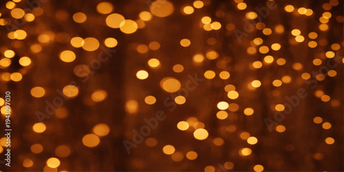 Golden abstract bokeh background with bright glowing gold lights for Christmas holiday celebration and decoration